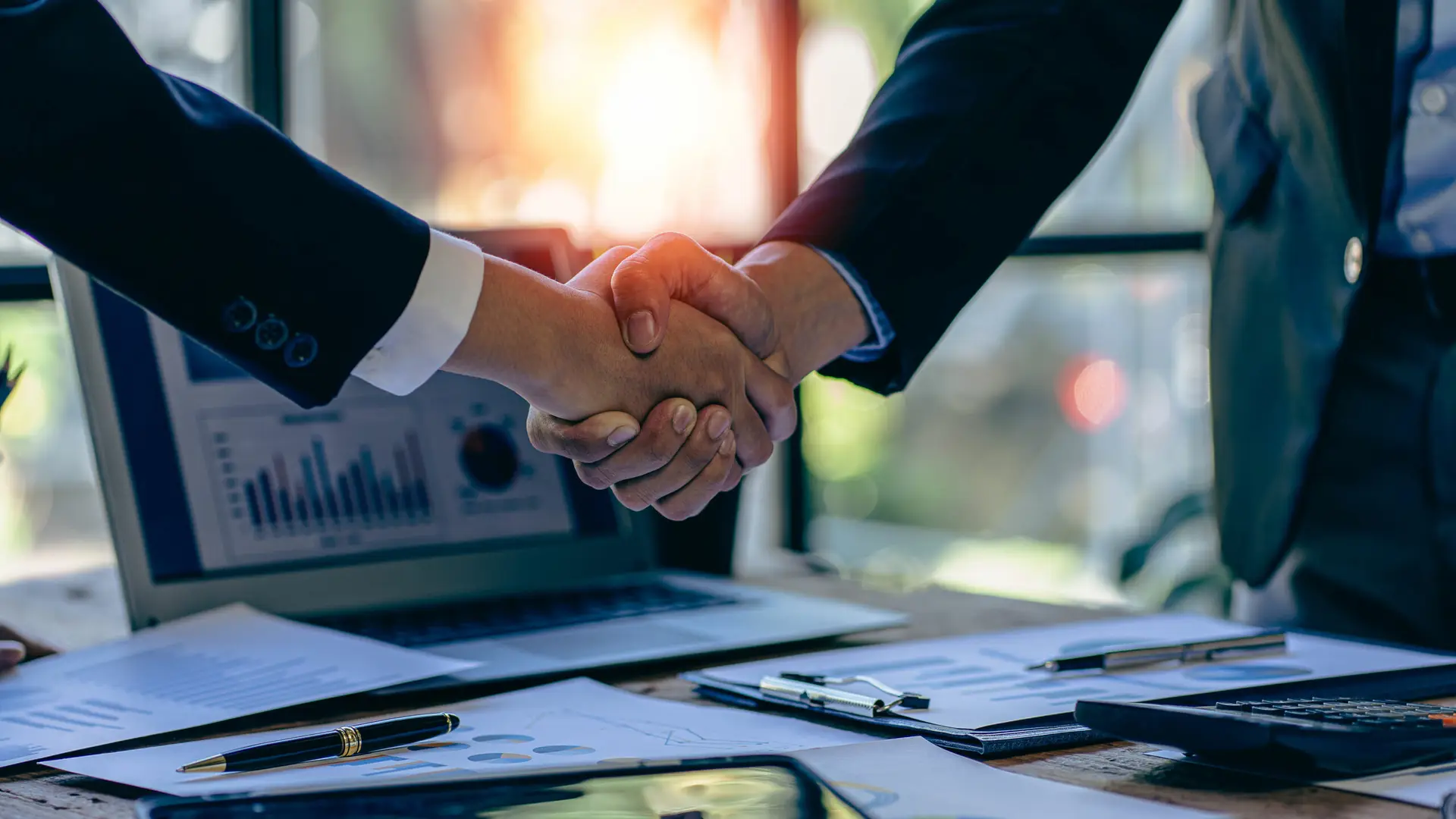 young businessman and businesswoman in investment agreement, two